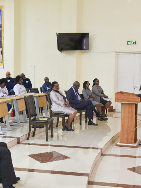 Kuttrh's CEO addressing people present at the meeting.
