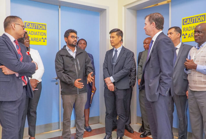 Dr. Harish Nagaraj, Head of Nuclear Medicine at KUTRRH addresses a delegation from AstraZeneca Ltd