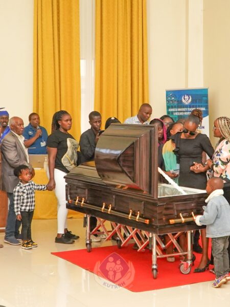 A section of KUTRRH staff paying tribute to their departed colleaque Mr Allan during a memorial service held at the Hospital's TRI Auditorium who succumbed after a long illness.